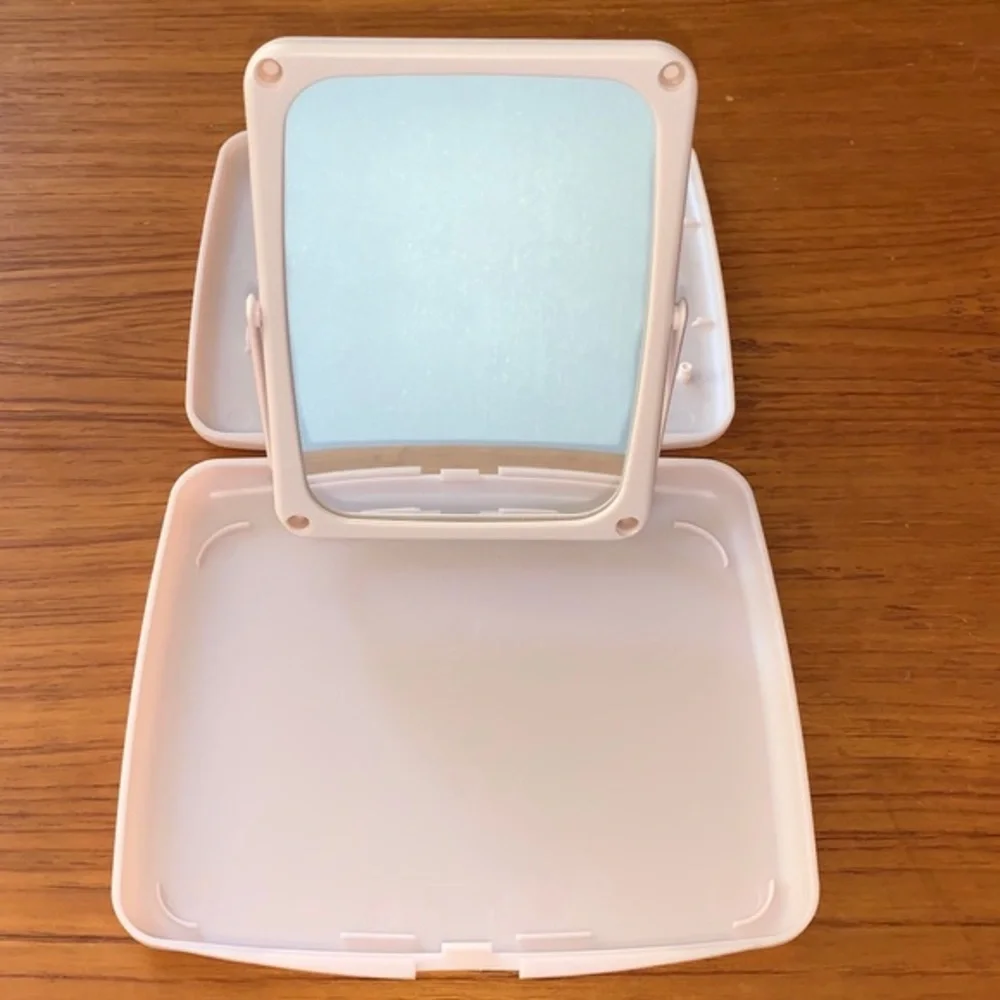 Mary Kay pink plastic compact travel mirror.